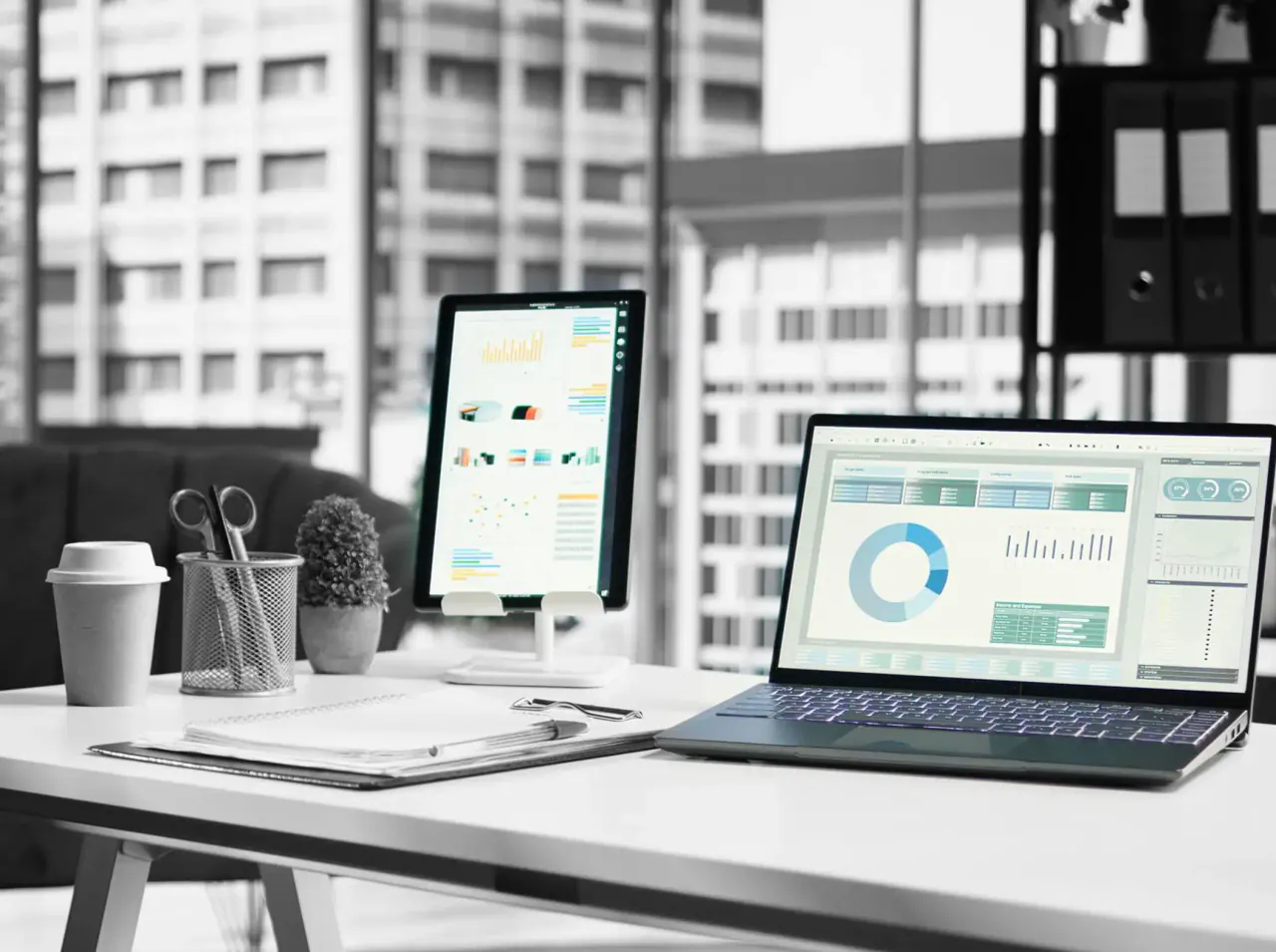 A job profitability report open on a laptop in a construction firm&rsquo;s office