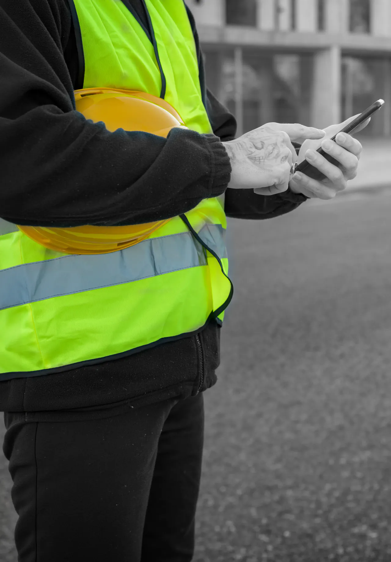 A site engineer using the Unibuild app on a construction site