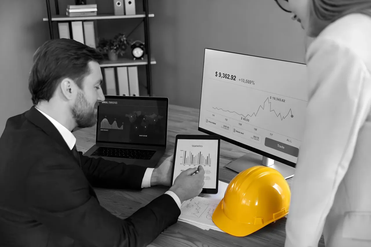 Construction finance team reviewing applications for payment in Unibuild