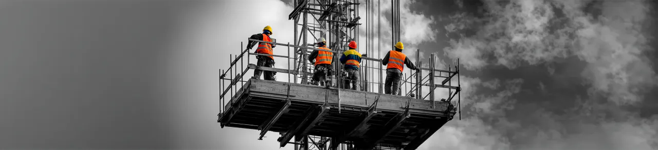 Construction team reviewing an approved holiday request on site
