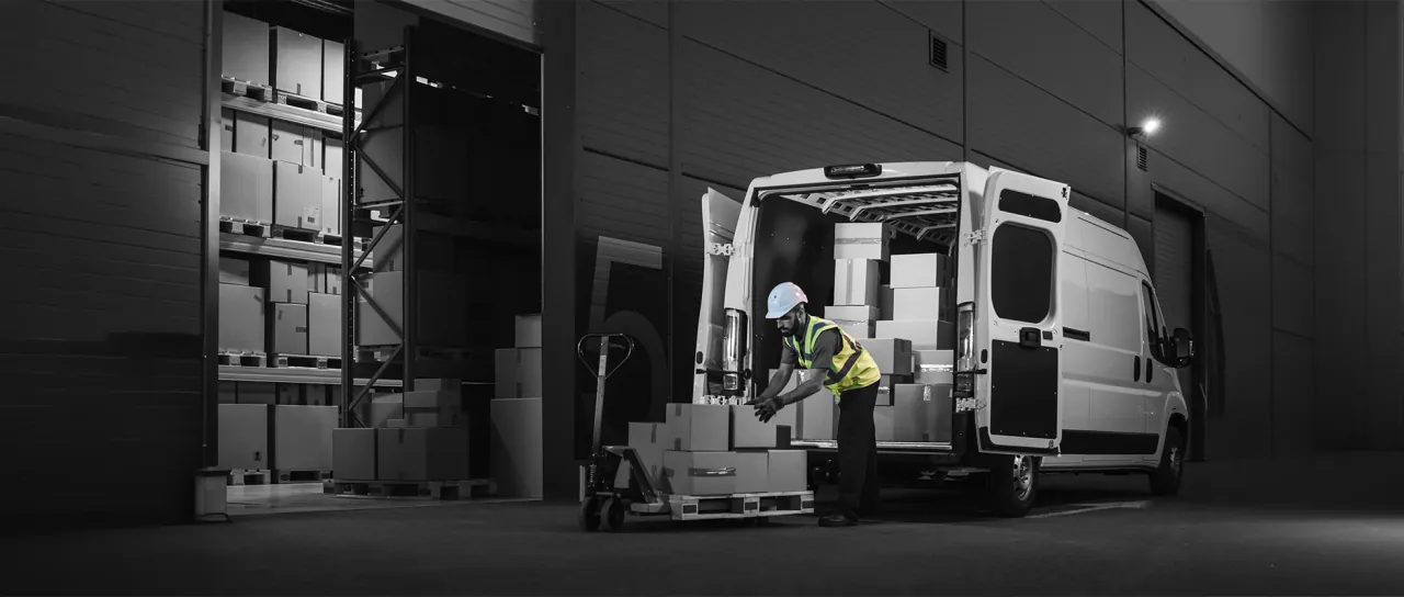 Construction worker checking a vehicle fleet on site