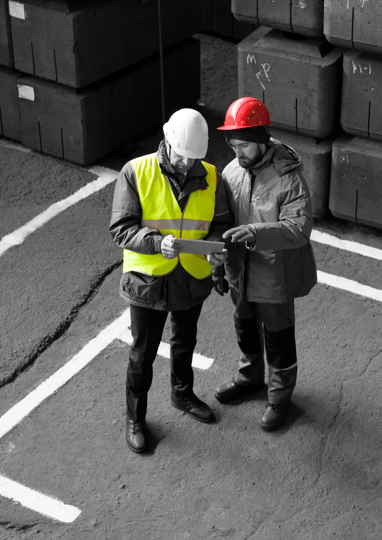 Workers on a construction site, whose hours and costs feed the live margin on the job