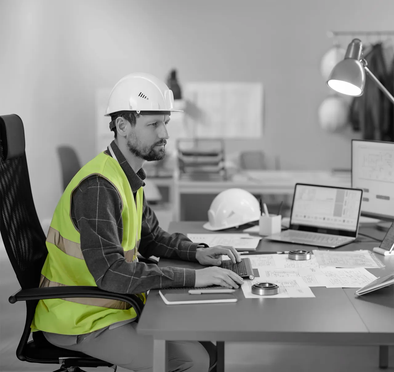 Office staff working in the Unibuild portal with purchase orders, documents and expiry reminders