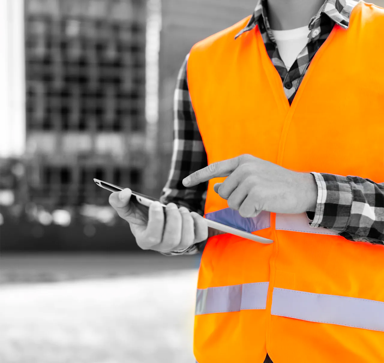 Site manager recording diaries, progress photographs and permits on site in Unibuild