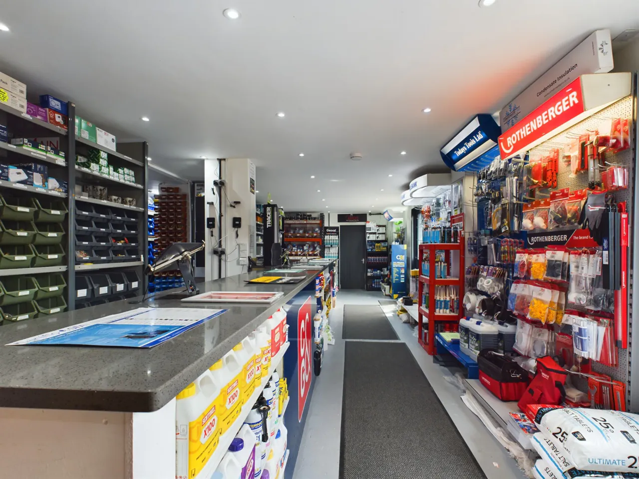 The C&amp;G trade counter in Erith, with the serving counter and card terminals on the left and picking bins, hand tools and consumables on the right