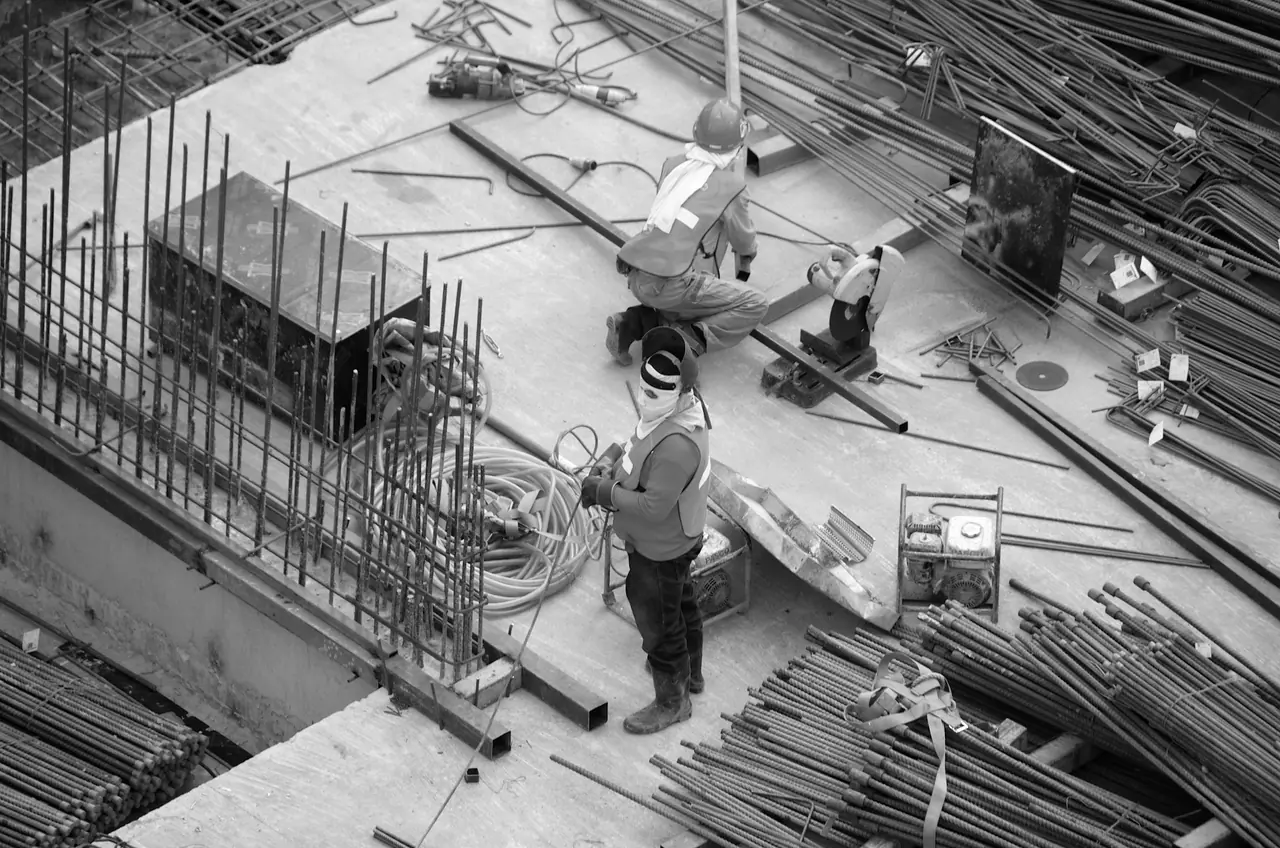 Steel erectors working on a frame on a UK construction site