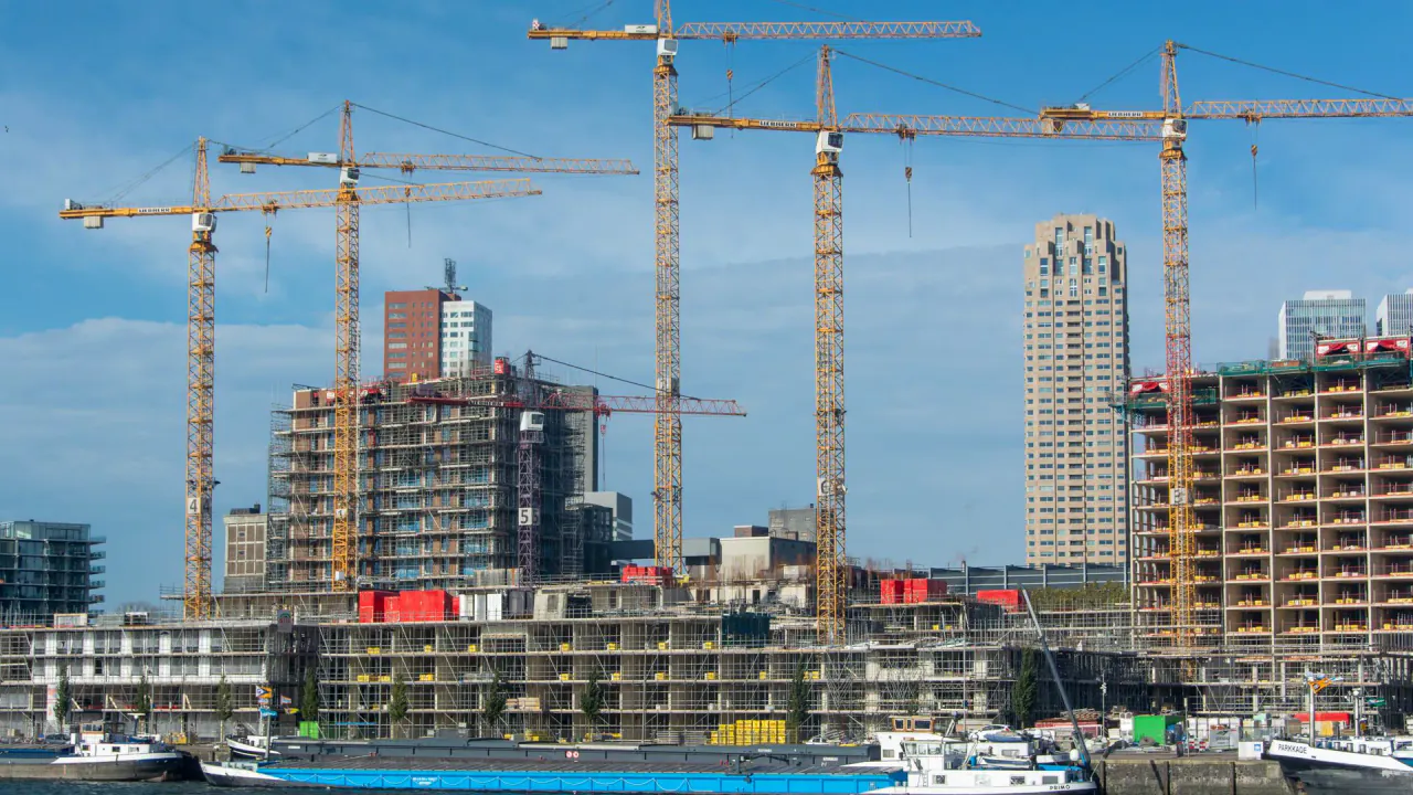 Tower cranes over a city construction site