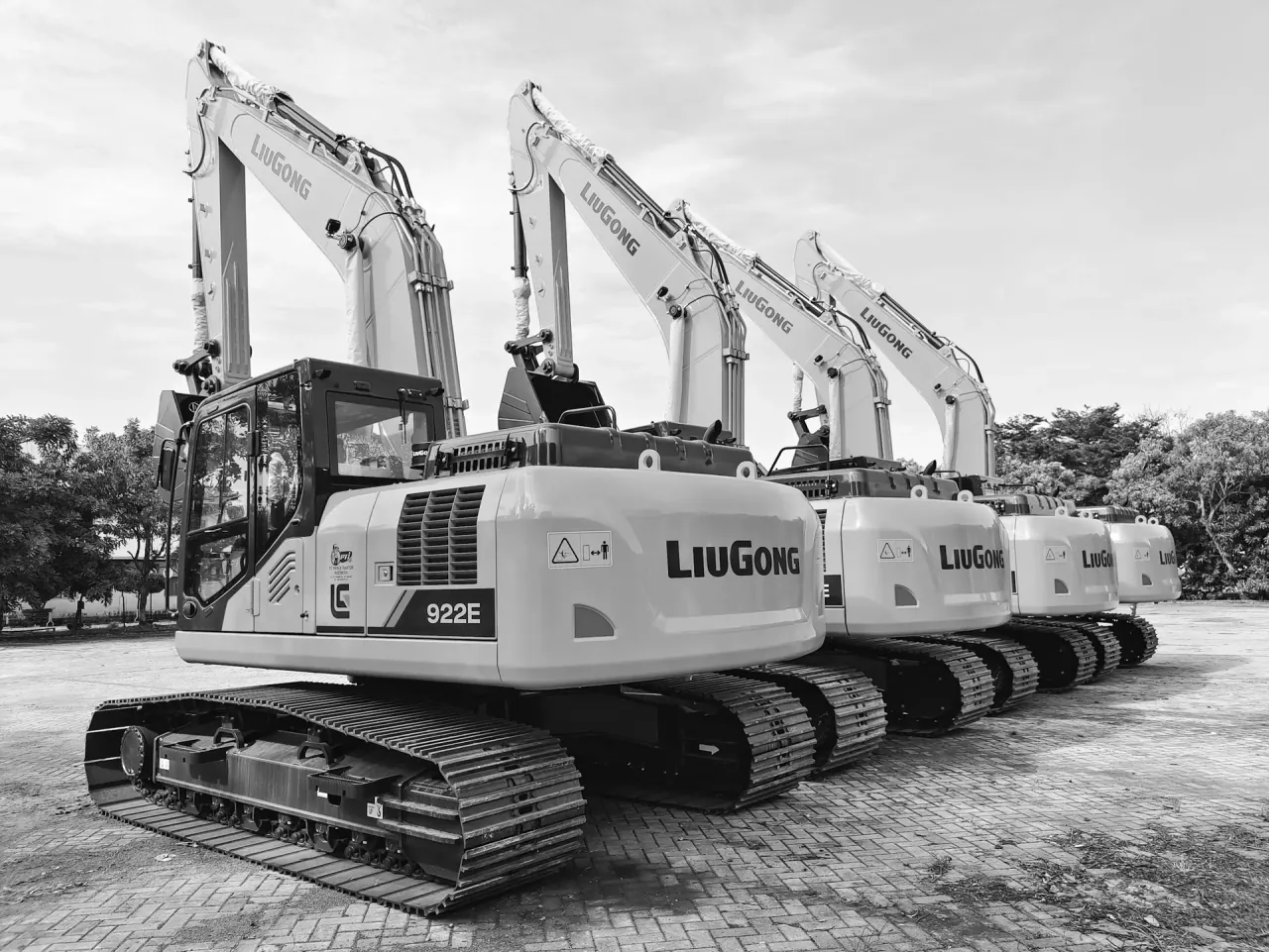 A row of tracked excavators