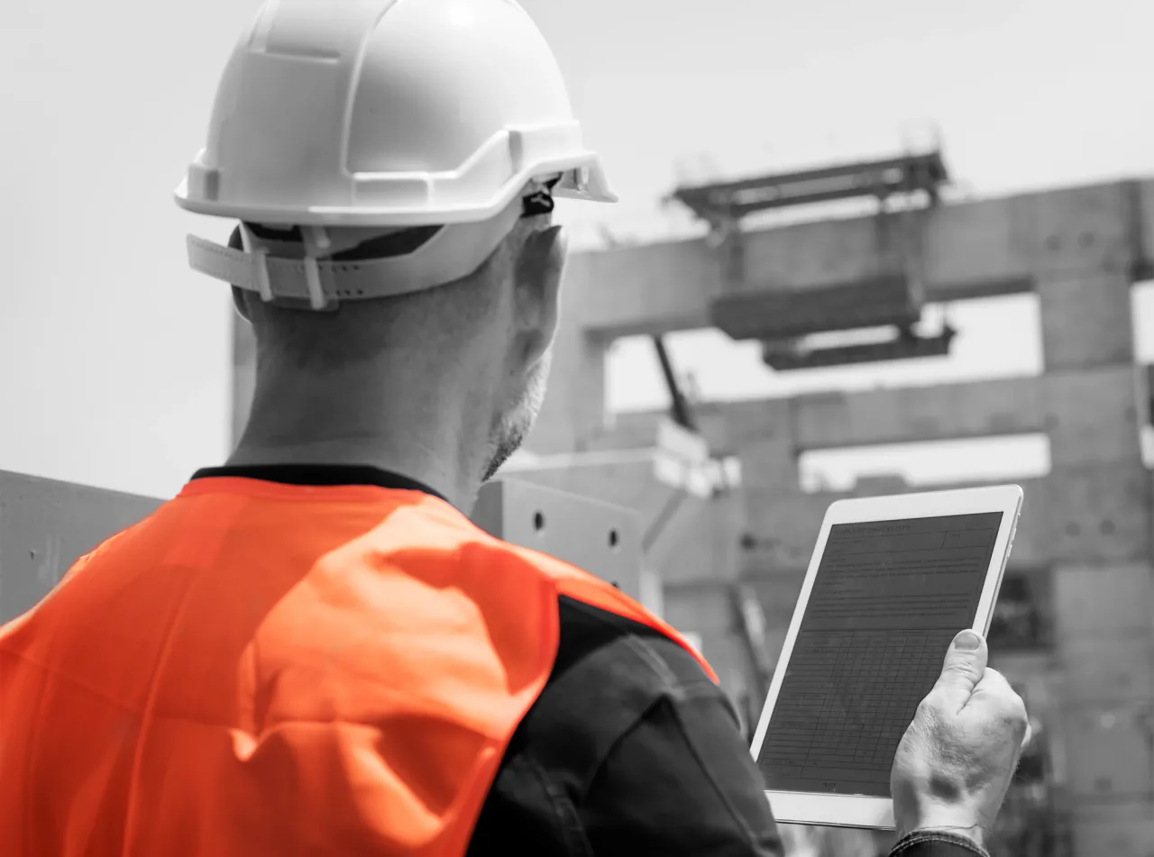 Construction team reviewing questions on a UK site