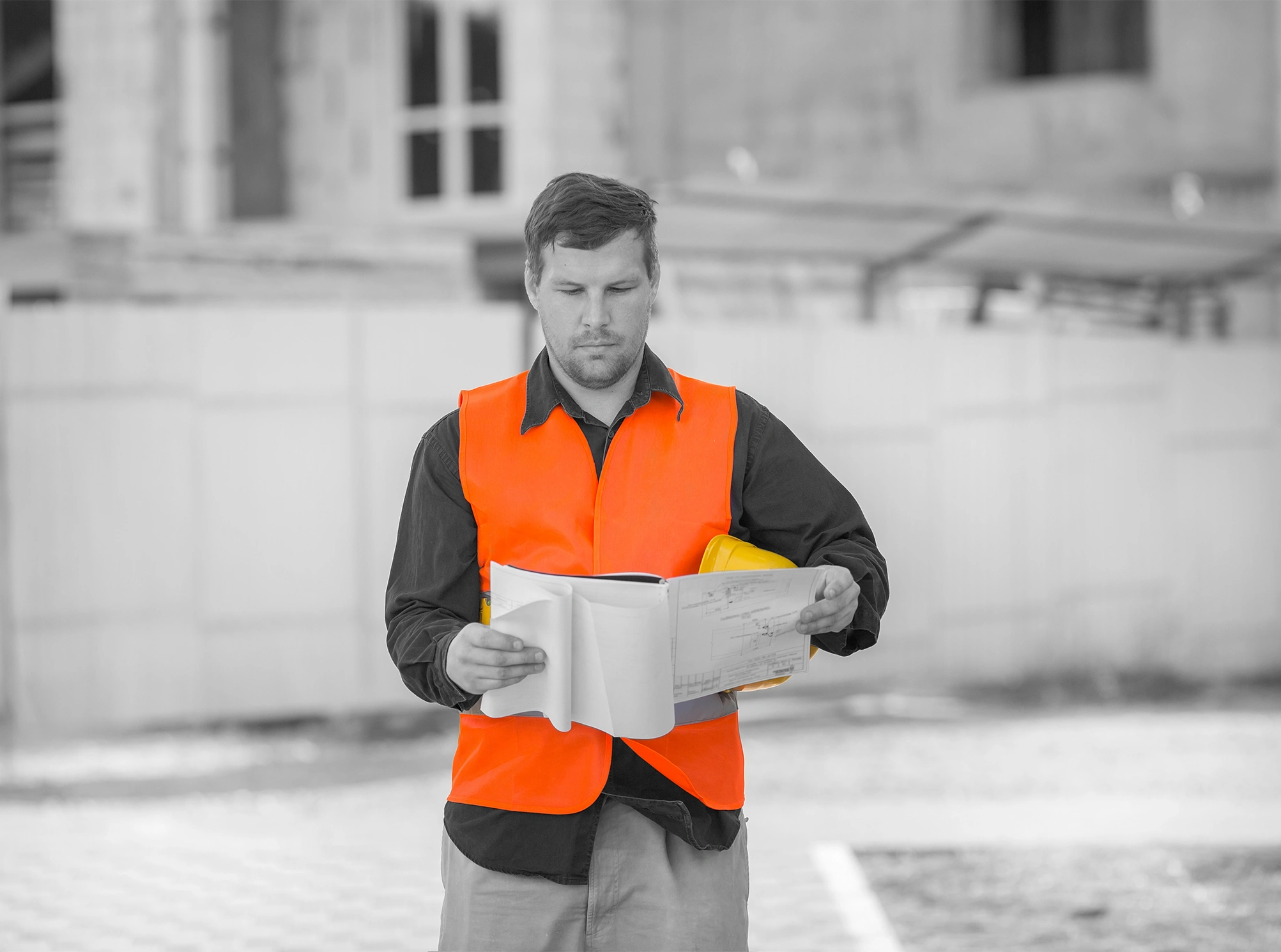 Construction professional reviewing site notes on a tablet